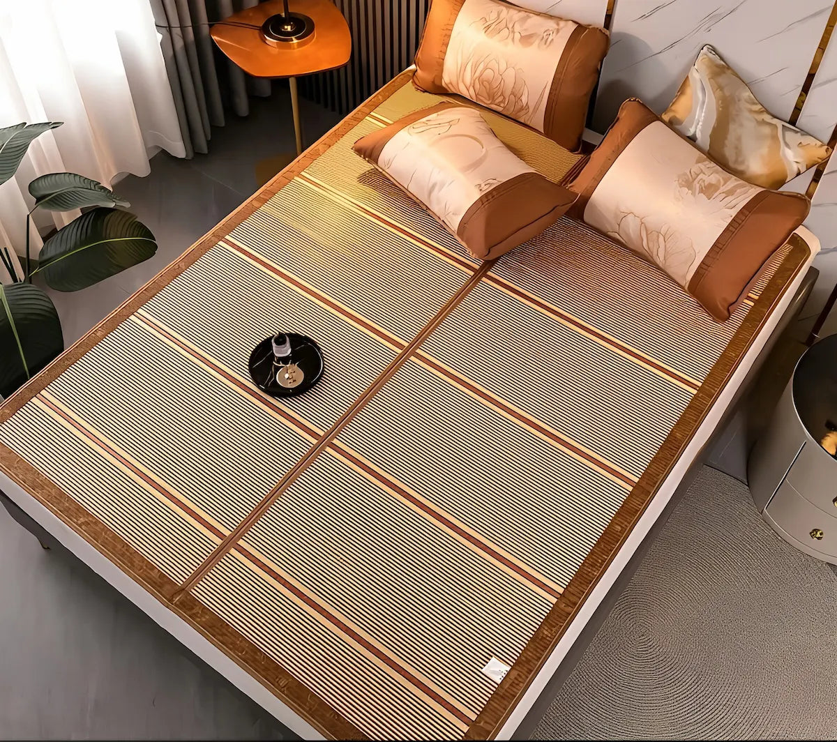 Bed with a woven mattress cover and decorative pillows in a room setting.