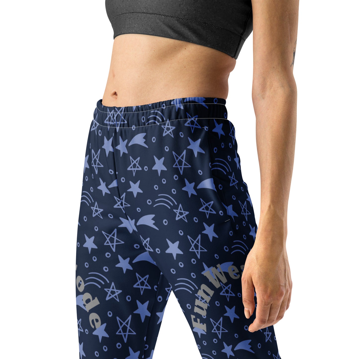 Navy blue athletic pants with star pattern and 'Fun Wear Code' text logo worn by a person on a white background