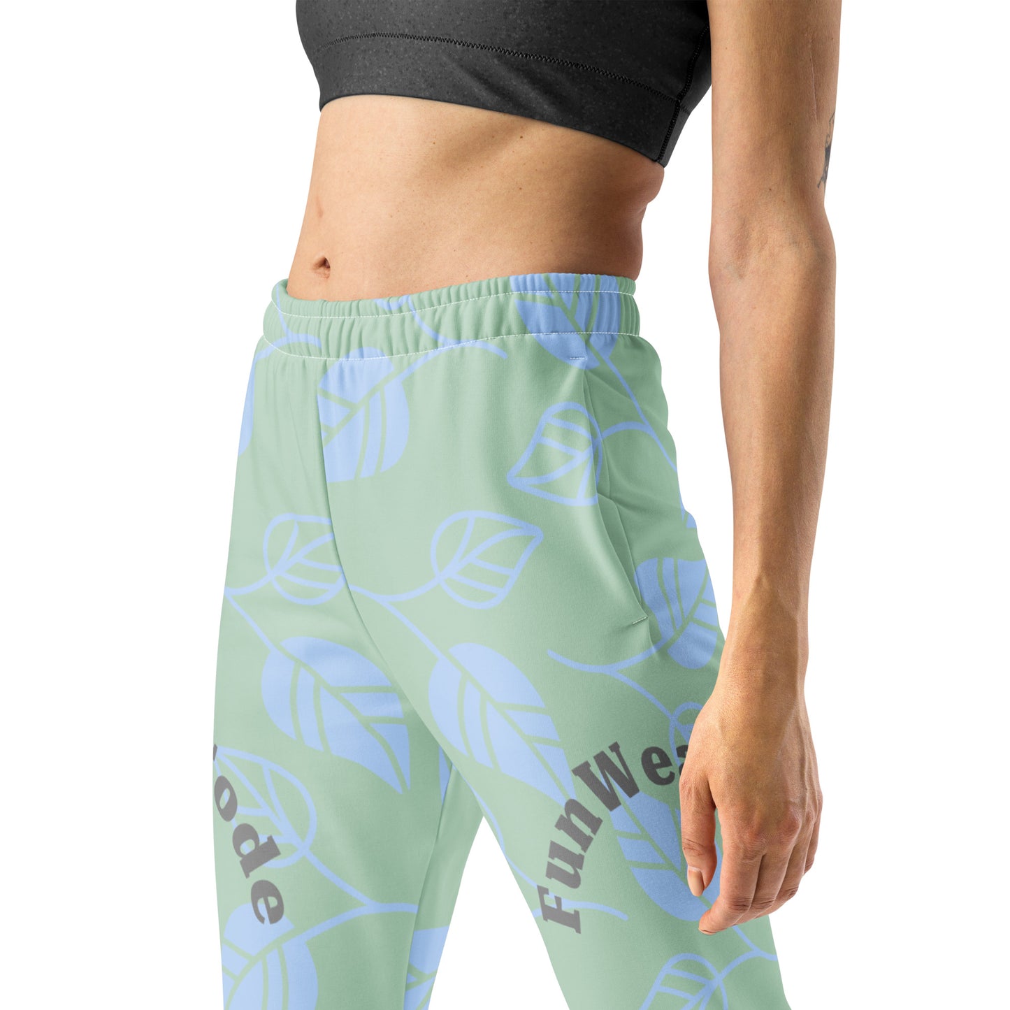 Light green jogger pants with blue leaf patterns and brand 'Fun Wear Code' logos on a white background