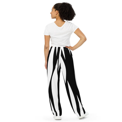 Woman wearing a white top and black and white striped pants with a 'Fun Wear Code' text logo on a white background