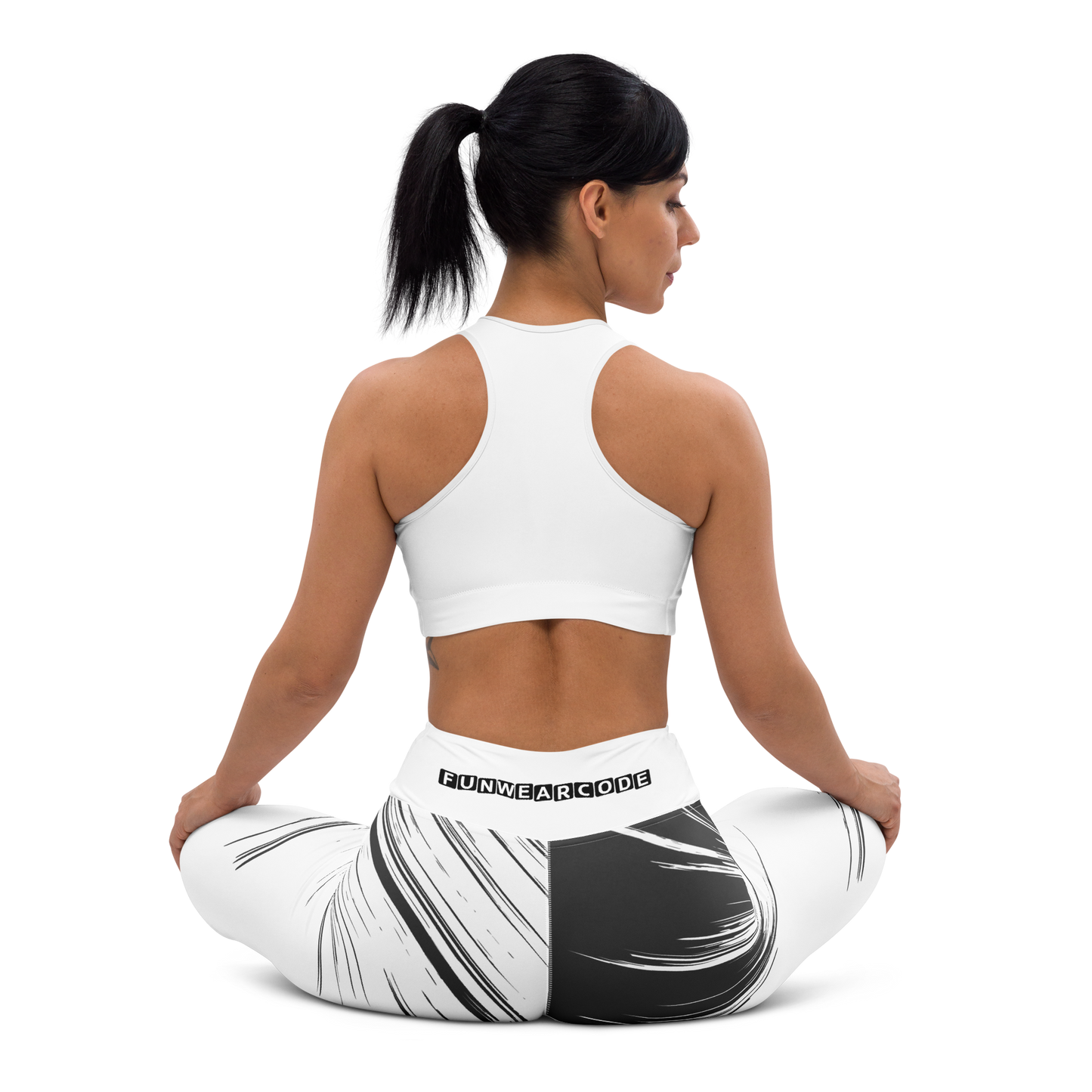Woman wearing a white sports bra and black and white patterned leggings with waistband brand logo 'Funwearcode' on a white background