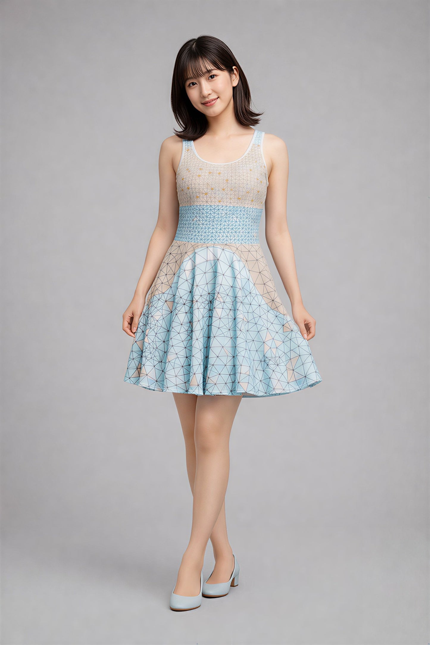 Woman wearing a light blue and white patterned dress on a gray background