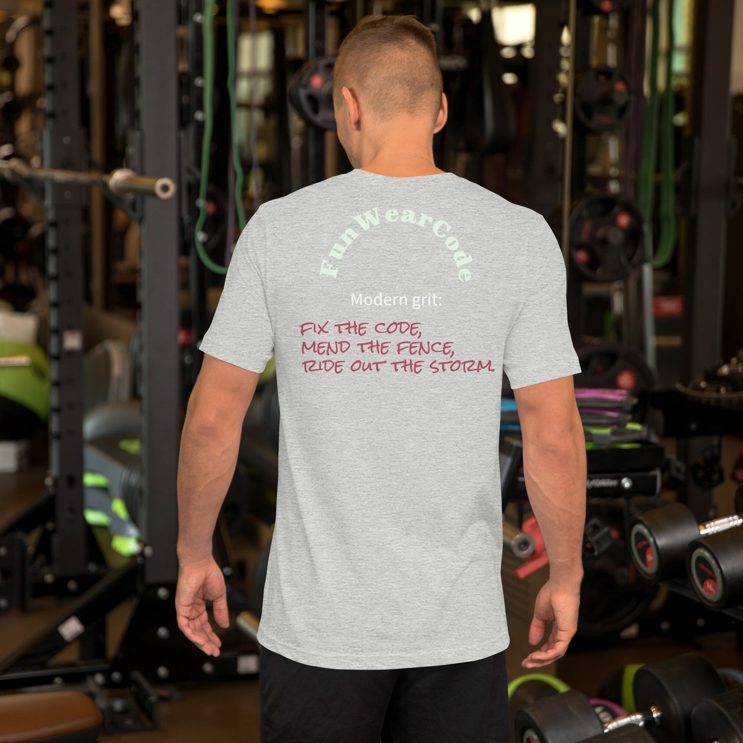 Person wearing a gray t-shirt with a 'Fun Wear Code' text logo in a gym setting