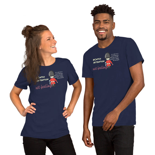 Two people wearing navy blue t-shirts with a playful guardsman graphic and text on a white background