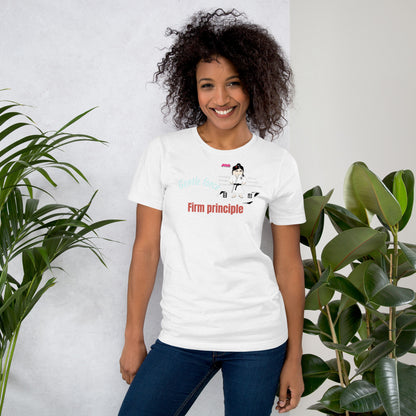 Woman wearing a white t-shirt with a judo graphic design and text, standing between two plants against a light background